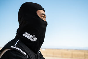 Profile View of Man wearing Black Head Sock