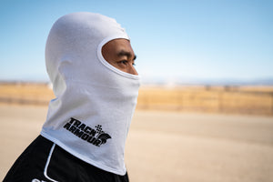 Profile View of Man wearing White Head Sock